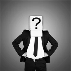 Businessman in a suit with a question mark box over his head, representing self-assessment for Executive Protection professionals