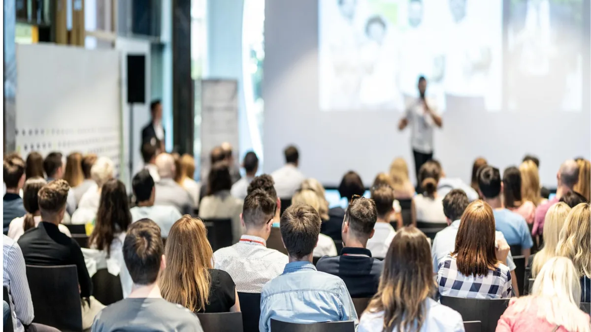 James Hamilton leading an executive protection training seminar in front of a seated audience